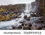 The Öxarárfoss waterfall flows out the river Öxará, cascading in two drops over the cliffs of Almannagjá gorge, which marks the eastern boundary of the North American and Eurasian tectonic plates. 