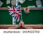 A Lady Holds Two Union Jack...