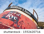 Small photo of Hastings / United Kingdom - January 28, 2010: A land based fishing vessel has Port of Rye and the name Rainbow Chaser visible.A weathered hull has peeling red paint.Editorial Image