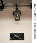 Small photo of New Orleans, LA USA - May 9, 2018 - Gas Lamp at 523 Iberville Street in the French Quarter