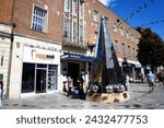 Small photo of EXETER, UK - AUGUST 22, 2023 - View of the Exeter Riddle sculpture along High Street in the city centre, Exeter, Devon, UK, Europe, August 22, 2023.