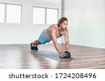 Small photo of Home gym medicine ball workout abs exercise stability body exercises man training tricep pushups.