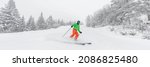 Small photo of Man skiing. People on ski in Alpine ski concept - Skier skiing downhill doing hockey stop at mountain snow covered ski trail slopes in winter on perfect powder snow day in nature. Panoramic banner