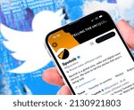 Small photo of Antalya, Turkey - March 01, 2022: Man holding smartphone with Sputnik Twitter account on screen standing in front of Twitter home screen shot.