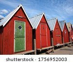 Beautiful red fishing huts on the coast Faaborg Denmark
