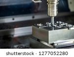 Small photo of The operation of CNC milling machine .The CNC milling machine chamfering the mold part with chamfer tool .