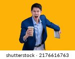 Successful complete Active Happiness asian cheerful exited young businessman running action while holding tablet and coffee mug in isolated on studio yellow colour background
