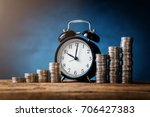 business financial ideas concept with coins stack and alarmclock isolate background with free copyspace for your creativity ideas text