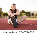 young muscular athletic runner... | Shutterstock . vector #2065796516