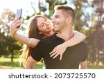 young happy millennial couple... | Shutterstock . vector #2073725570